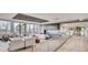Upscale building lobby and seating area with fireplace, TV, and a clear view of the outdoors at 4200 W 17Th Ave # 1013, Denver, CO 80204