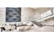 Inviting lobby area featuring stone accent wall, staircase with glass railing and stylish modern decor at 4200 W 17Th Ave # 1013, Denver, CO 80204