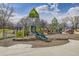 Community playground featuring colorful play structures, slides, and climbing areas with a gazebo nearby at 4200 W 17Th Ave # 1013, Denver, CO 80204