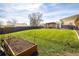 Spacious backyard featuring a garden bed, wooden pergola, well-manicured lawn and an outdoor living space at 10500 Marion St, Northglenn, CO 80233