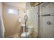 Clean bathroom with glass shower doors and small vanity with sink at 10500 Marion St, Northglenn, CO 80233