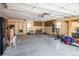 Spacious garage with plenty of storage, a black refrigerator, workout equipment, and space for a workshop at 10500 Marion St, Northglenn, CO 80233