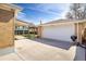 A detached garage with ample parking, a BBQ grill and easy access to the backyard and covered patio at 10500 Marion St, Northglenn, CO 80233
