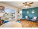 Stylish living room featuring hardwood floors and a colorful accent wall at 10500 Marion St, Northglenn, CO 80233