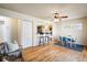 Cozy living room with hardwood floors, dining area, and open layout at 10500 Marion St, Northglenn, CO 80233