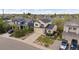 Aerial view of a home with manicured lawn in a residential neighborhood with mature trees and landscaping at 4915 Parsons Way, Castle Rock, CO 80104