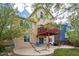 Backyard view showcasing a deck, patio, and mature trees, creating a private oasis at 4915 Parsons Way, Castle Rock, CO 80104