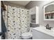Charming bathroom featuring a dinosaur shower curtain and coordinated decor at 4915 Parsons Way, Castle Rock, CO 80104