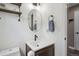 Charming powder room with modern fixtures, a vessel sink, and a decorative mirror at 4915 Parsons Way, Castle Rock, CO 80104