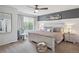 Comfortable bedroom with a ceiling fan, natural light, and calming color palette at 4915 Parsons Way, Castle Rock, CO 80104
