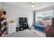 Playful bedroom with toys, a TV, and a view of the outdoors at 4915 Parsons Way, Castle Rock, CO 80104