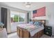 Bright bedroom with themed bedding, large window, and natural light at 4915 Parsons Way, Castle Rock, CO 80104