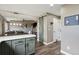 Open concept kitchen with modern cabinets, a barn door, and hardwood floors at 4915 Parsons Way, Castle Rock, CO 80104