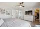 Spacious main bedroom featuring a ceiling fan, closet, and an ensuite bathroom at 4915 Parsons Way, Castle Rock, CO 80104