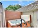 Backyard features a hot tub, a brick wall, and views of the landscape at 3481 S Race St, Englewood, CO 80113