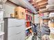 Unfinished basement corner is ready for storage with shelving and organizers at 3481 S Race St, Englewood, CO 80113
