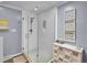Beautiful bathroom featuring glass enclosed shower with tile surround, and modern vanity at 3481 S Race St, Englewood, CO 80113