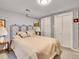 Well-lit bedroom features a comfortable bed and double door closet at 3481 S Race St, Englewood, CO 80113