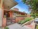 Charming brick home with a gated entrance and beautiful flower boxes, offering a warm and inviting curb appeal at 3481 S Race St, Englewood, CO 80113