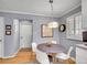 Charming breakfast nook with a round table, natural light, and a view of the entry door at 3481 S Race St, Englewood, CO 80113