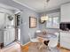 Bright breakfast nook off the kitchen, featuring a round table and plenty of natural light at 3481 S Race St, Englewood, CO 80113