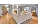 Open-concept living room featuring hardwood floors, a cozy fireplace, and stylish decor at 3481 S Race St, Englewood, CO 80113