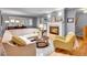 Living room with fireplace, wood floors, and bright lighting at 3481 S Race St, Englewood, CO 80113
