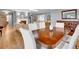 Spacious open-concept living area with hardwood floors, fireplace, and elegant furnishings at 3481 S Race St, Englewood, CO 80113