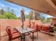 Tranquil outdoor patio featuring a dining table and shade umbrellas, perfect for enjoying outdoor meals at 3481 S Race St, Englewood, CO 80113