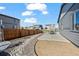 Backyard with gravel landscaping and a concrete patio at 1868 Homestead Dr, Fort Lupton, CO 80621