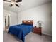 A cozy bedroom with a comfortable bed, a nightstand, and neutral decor at 1868 Homestead Dr, Fort Lupton, CO 80621
