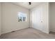 Bedroom features carpet, a bright window, and a closet at 1868 Homestead Dr, Fort Lupton, CO 80621