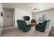 Cozy living room with comfortable sofas, a modern TV stand, and neutral decor at 1868 Homestead Dr, Fort Lupton, CO 80621