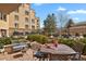 Inviting patio with comfortable seating, perfect for outdoor relaxation and entertaining with lush landscaping around it at 2500 E Cherry Creek South Dr # 116, Denver, CO 80209