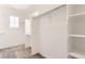 Spacious walk-in closet with built-in shelving and ample hanging space, perfect for organized storage at 647 Nightsky St, Erie, CO 80516