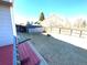 View of a fully fenced backyard with a storage shed, offering privacy and plenty of space for outdoor activities at 4996 S Gibraltar Way, Centennial, CO 80015