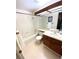 Bathroom featuring a vanity, sink, mirror, and combined shower-tub at 4996 S Gibraltar Way, Centennial, CO 80015