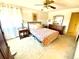 Bright bedroom with floral bedding, wood furniture, and natural light from the window at 4996 S Gibraltar Way, Centennial, CO 80015