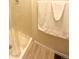 Shower with white tile and a towel hanging on the wall at 4996 S Gibraltar Way, Centennial, CO 80015