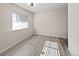 Basement with natural light showcasing hardwood floors and neutral-toned walls at 591 Brennan Cir, Erie, CO 80516