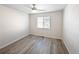 This bright bedroom features neutral walls, and hardwood floors, providing a serene atmosphere at 591 Brennan Cir, Erie, CO 80516