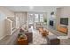 Bright living room featuring neutral paint, fireplace, and many windows letting in natural light at 591 Brennan Cir, Erie, CO 80516