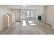 Bright living room featuring neutral paint, fireplace, and many windows letting in natural light at 591 Brennan Cir, Erie, CO 80516