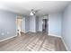 Bright living room featuring hardwood floors, neutral walls, and plenty of space at 591 Brennan Cir, Erie, CO 80516