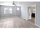 This light-filled bedroom features hardwood floors and an attached modern bathroom at 591 Brennan Cir, Erie, CO 80516