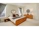 Large main bedroom with a king-size bed and ample closet space at 3016 Greensborough Dr, Highlands Ranch, CO 80129