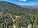 Secluded mountain home nestled amongst mature trees at 33884 Bergen View Trl, Evergreen, CO 80439