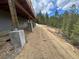 Spacious backyard area under construction with natural hillside surroundings at 33884 Bergen View Trl, Evergreen, CO 80439