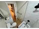 Modern bathroom features marble tile, matte black fixtures, and wood look flooring at 33884 Bergen View Trl, Evergreen, CO 80439