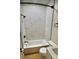 Modern bathroom featuring marble tile, modern fixtures, and built-in tub and shower at 33884 Bergen View Trl, Evergreen, CO 80439
